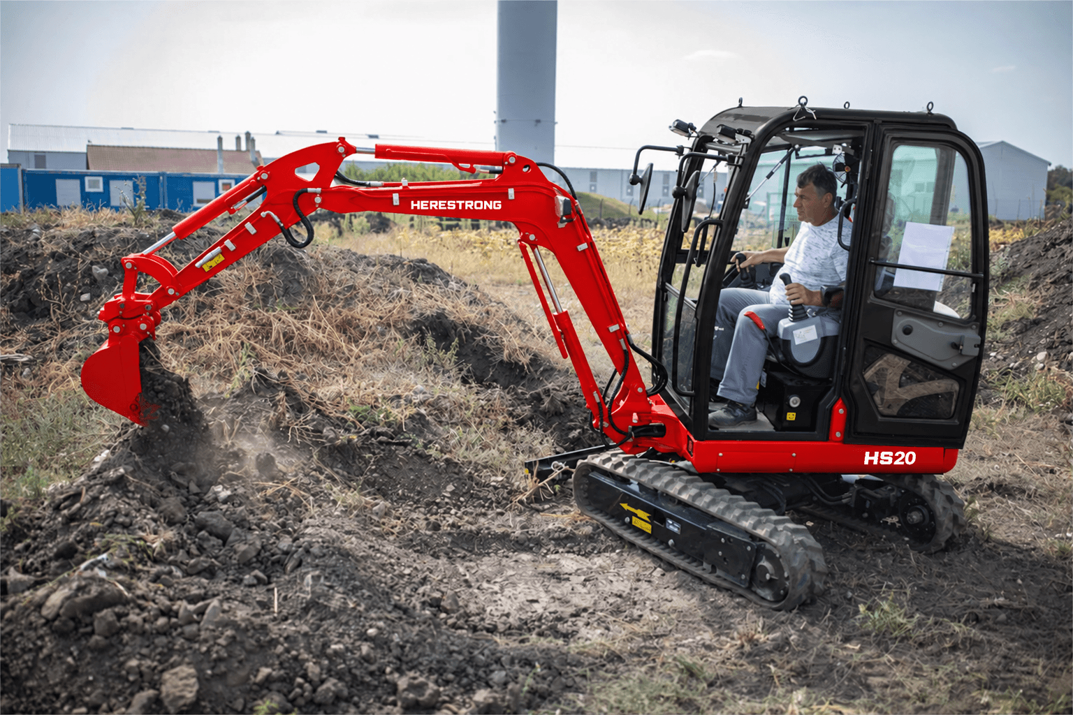 HERESTRONG HS20 excavator working with its operator inside the enclosed cab